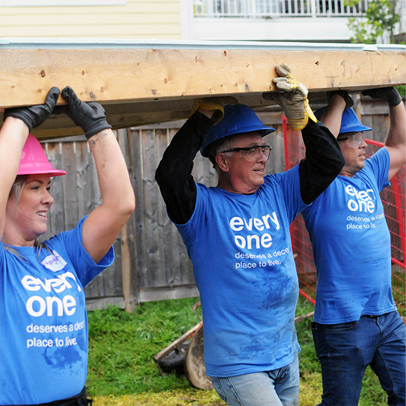 ZucoraHome employees volunteering in Habitat for humanity build.